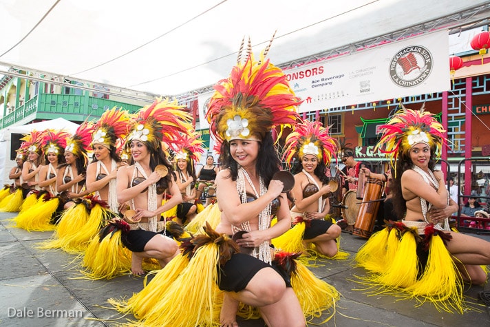 Professional Polynesian dancers performing at a corporate tropical event