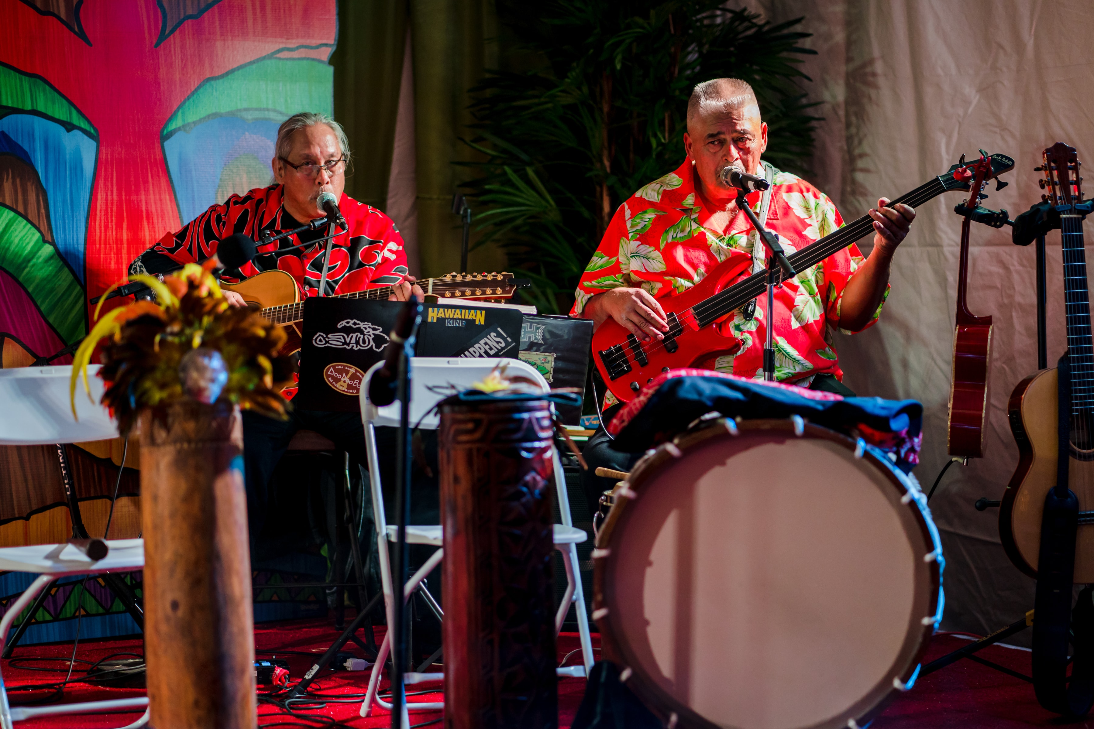 Hawaiian live music band performing together at a luau event